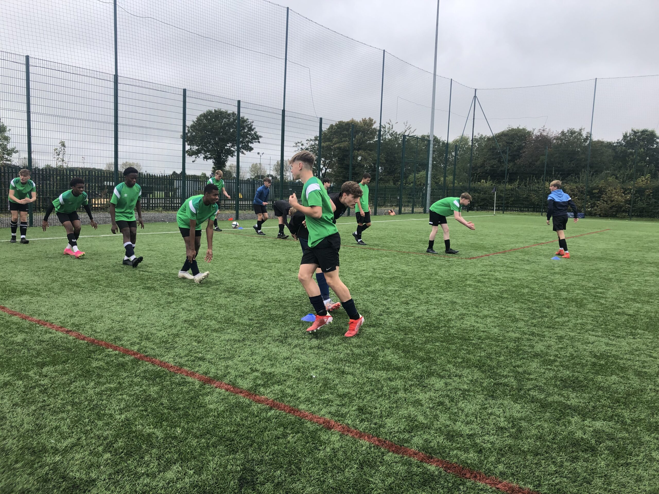 U14 academy-pathway footballer running a timed agility test during a VLTIX combine