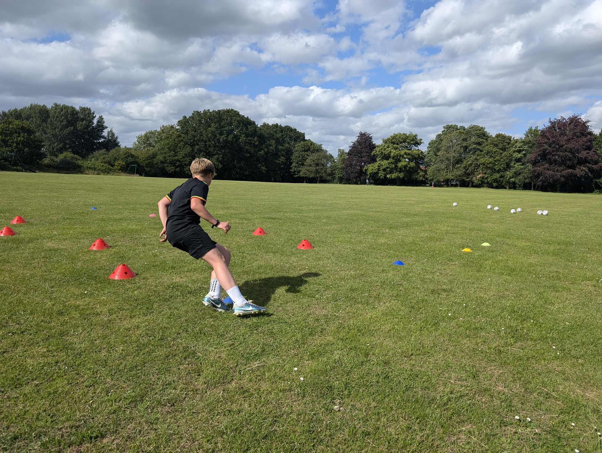 Football scout using objective performance data to identify talented young players